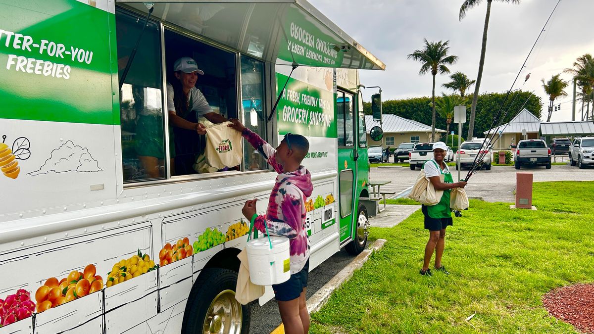 Person buying goods from the Sprouts Mobile Truck