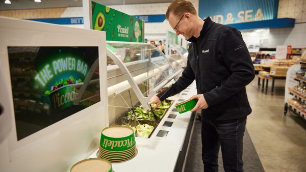 A tech-driven salad bar in a grocery store.